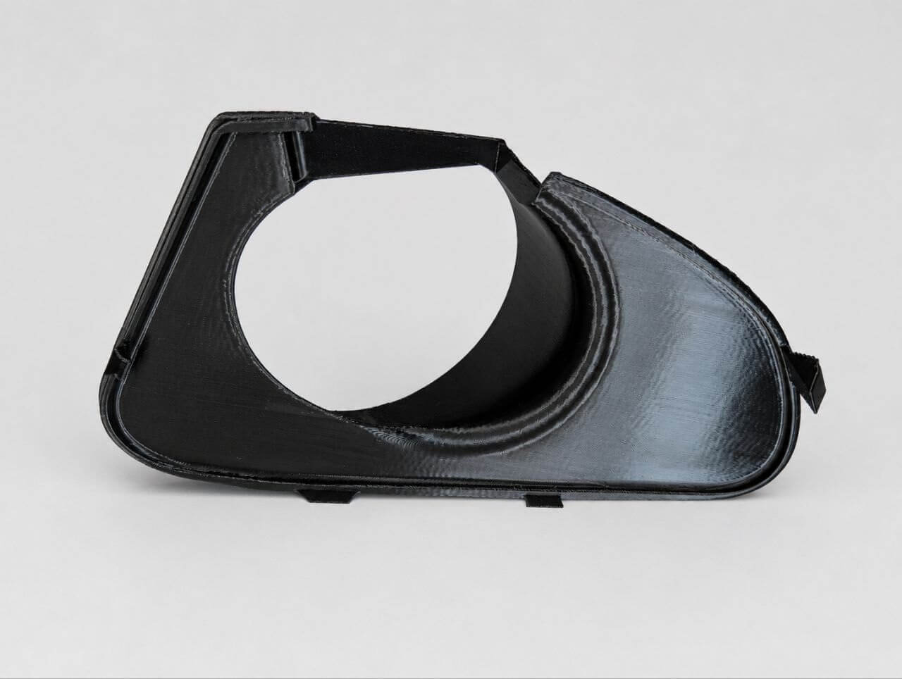 3D-printed front bumper grille with a glossy black finish