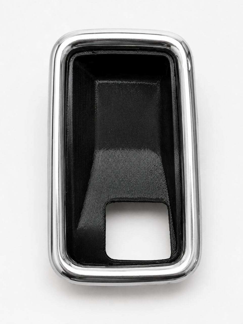 Black interior car door handle bracket with chrome trim