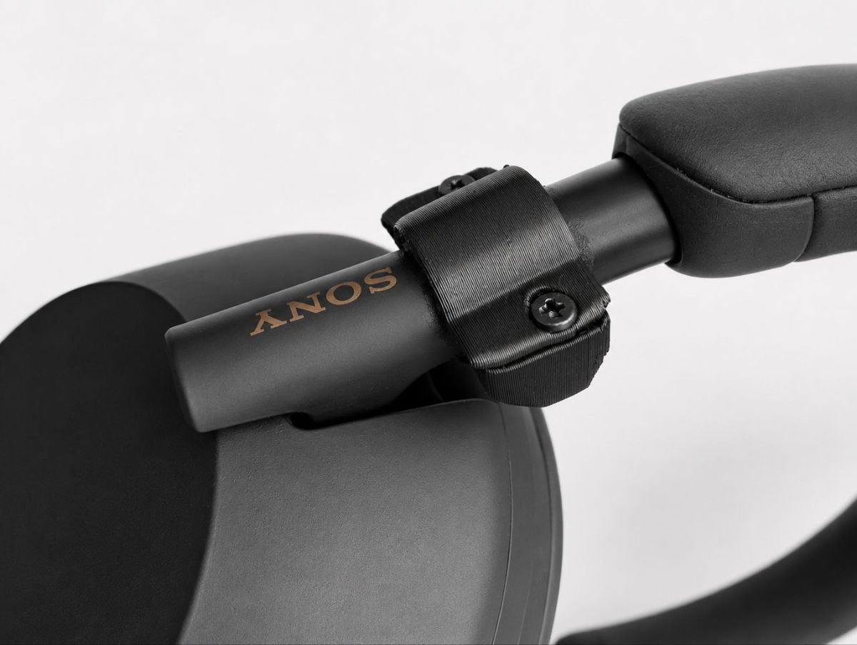 3D-printed replacement part installed on a headphone headband