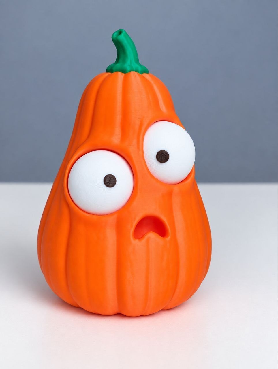 3D-printed decorative pumpkin with large cartoon eyes