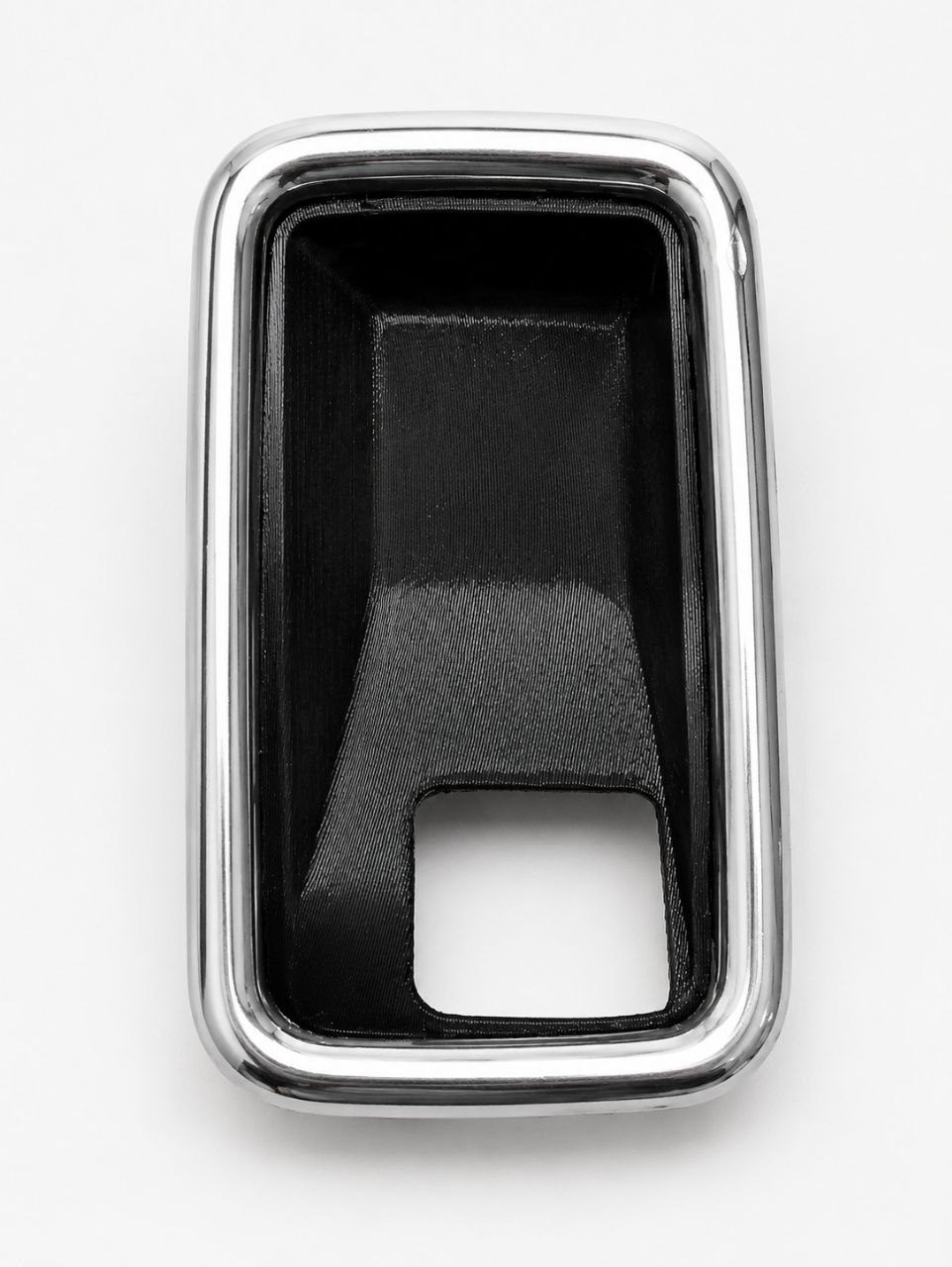 Black interior car door handle bracket with chrome trim