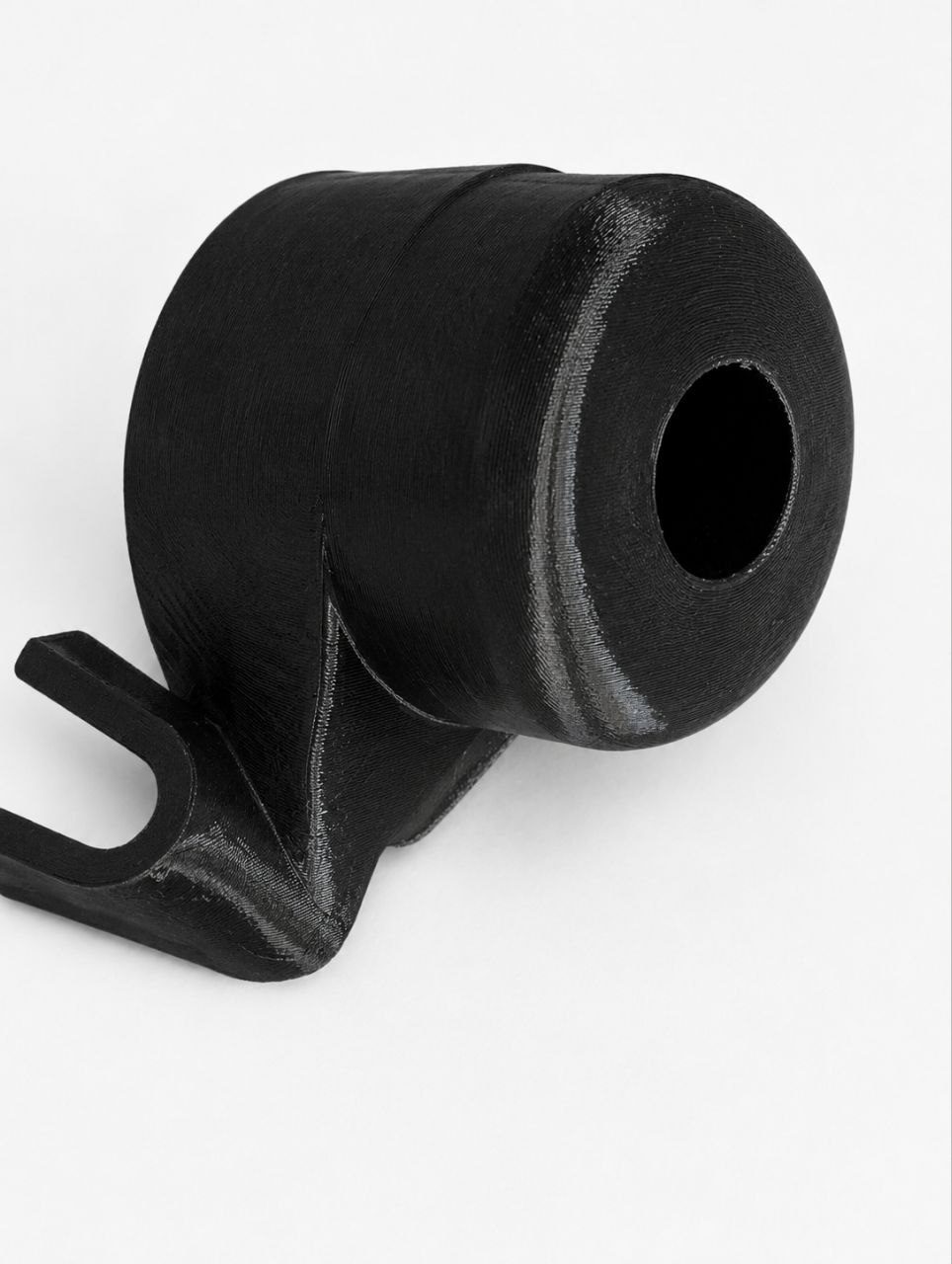 Black cylindrical component with a fork-shaped bushing at the base
