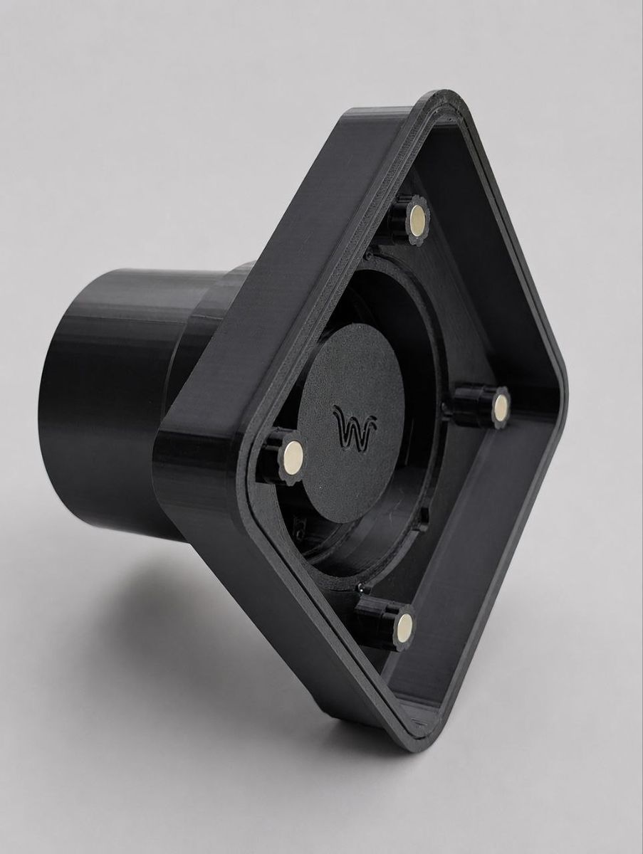 Black technical mount with embedded magnets and a diamond-shaped body