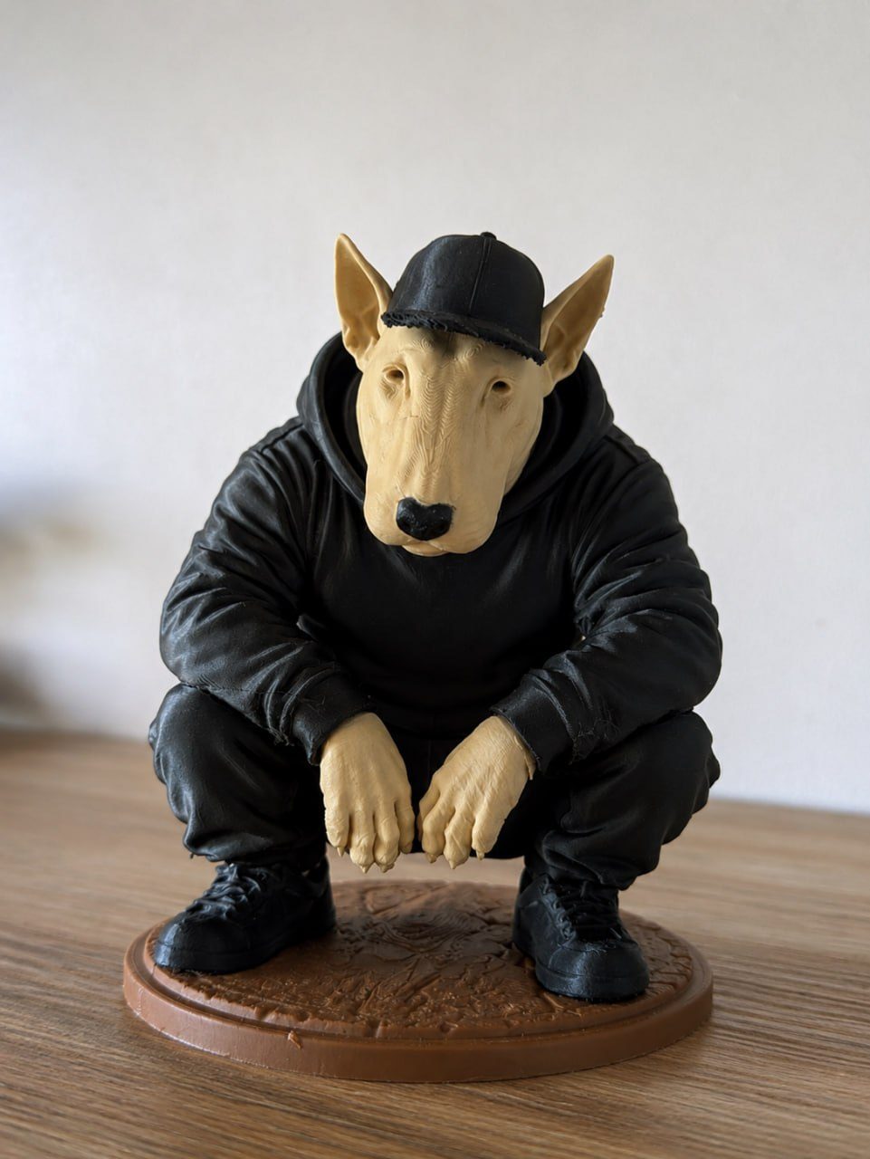 Anthropomorphic bull terrier figure in streetwear, seated