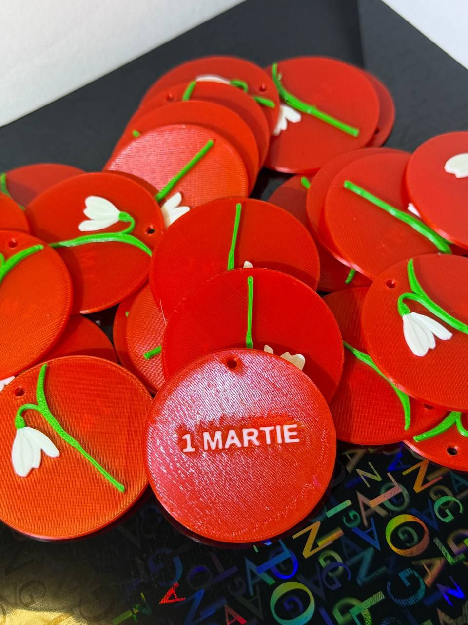 Red printed tokens with text for March 1