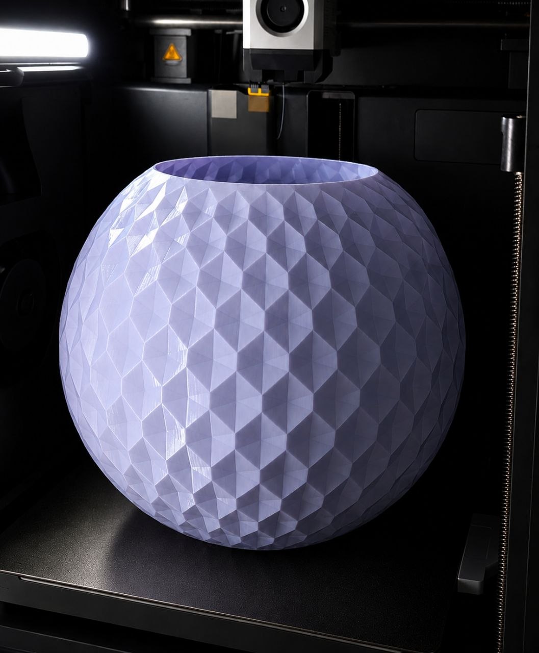 Large geometric vase on a 3D printer bed