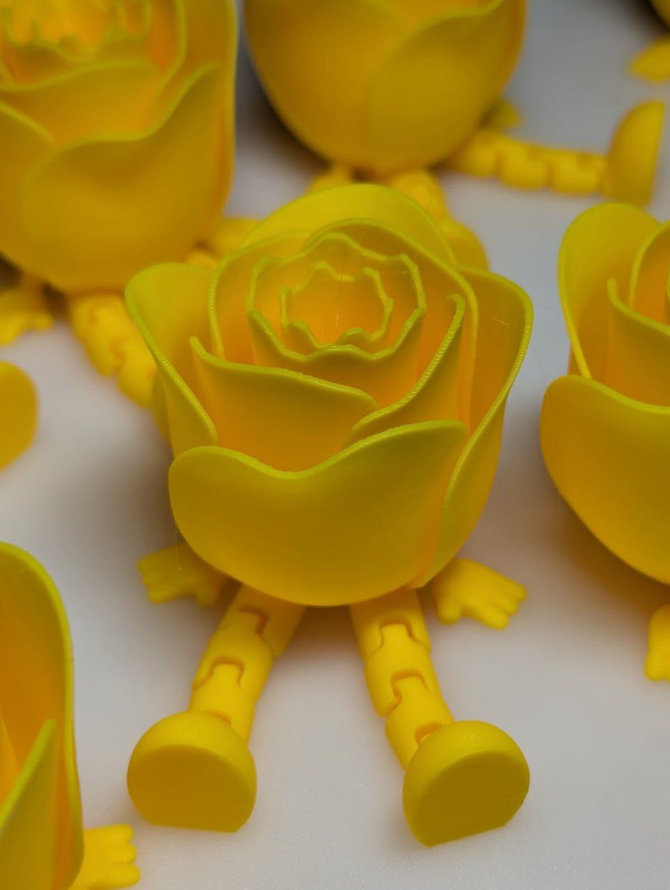 Yellow flower-like articulated figures