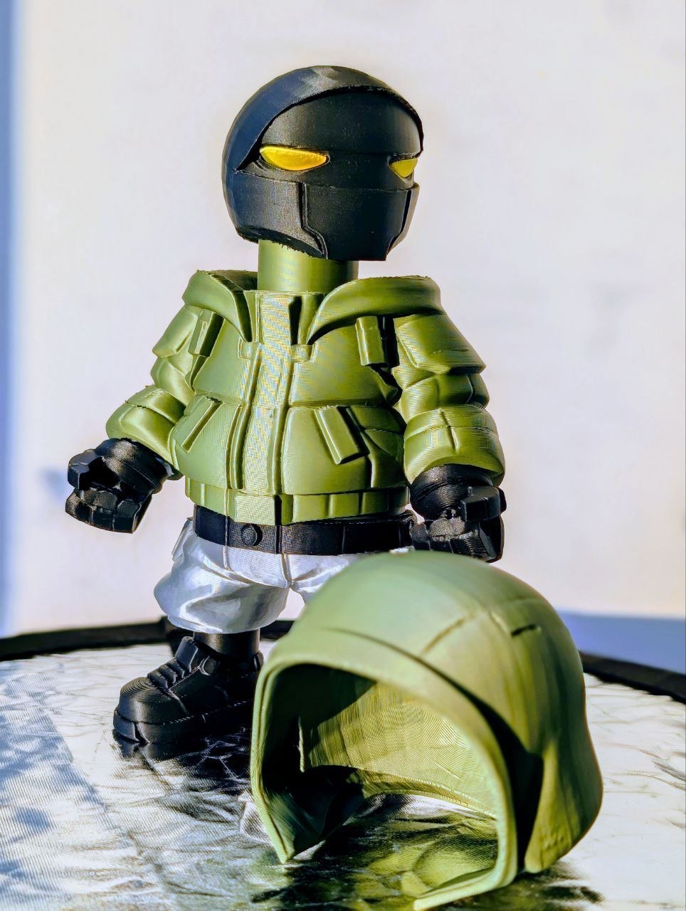 Collectible soldier-like figure with helmet