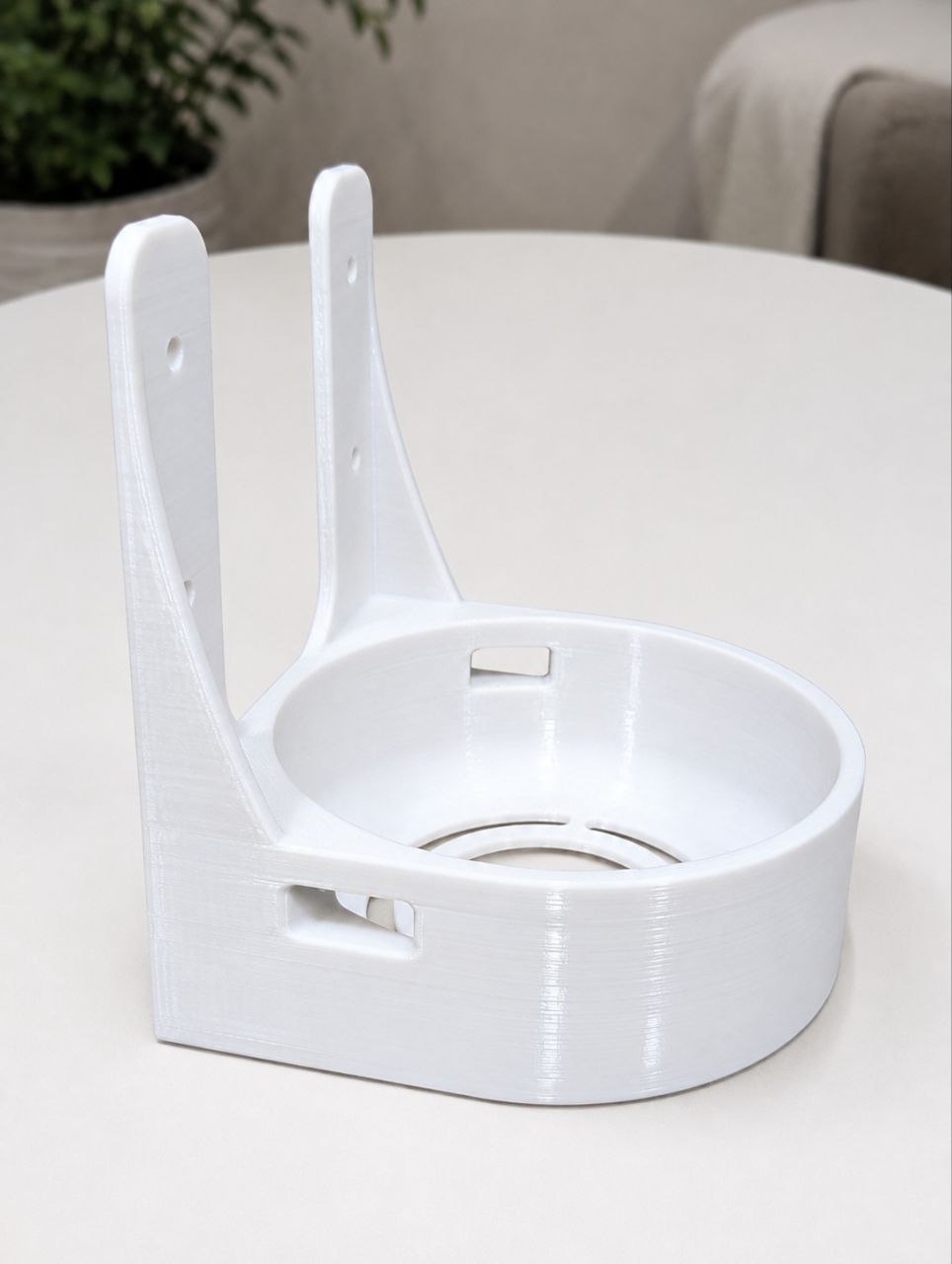 White wall-mounted holder printed in plastic