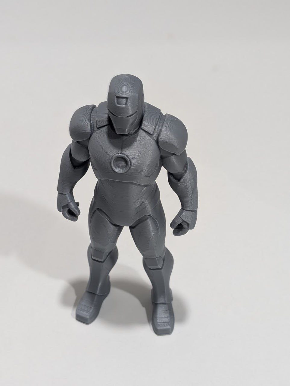 Grey 3D-printed superhero figure