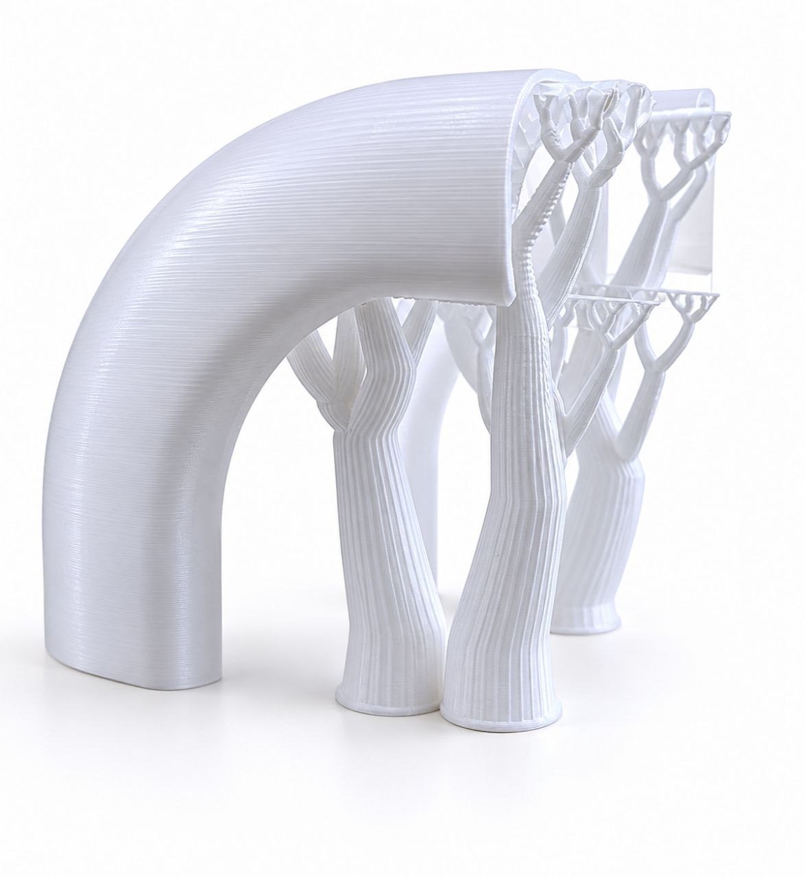 Close-up of a 3D-printed surface showing visible layer direction on curved geometry